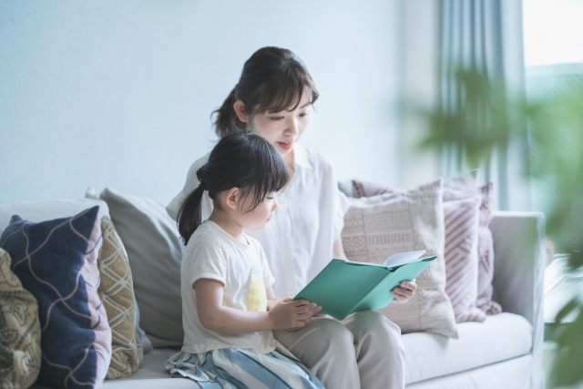 Parents and children reading books together